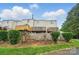 Exterior view of the backyard with a wooden fence and deck, ideal for privacy and outdoor enjoyment at 202 Water Oak Dr, Pineville, NC 28134