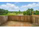 Backyard on a sunny day overlooking a park for relaxation and entertainment at 202 Water Oak Dr, Pineville, NC 28134