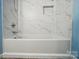 Clean, tiled bathtub/shower combo with niche, offering a sleek and modern bathroom design at 202 Water Oak Dr, Pineville, NC 28134