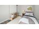 Simple, cozy bedroom with neutral decor, shelving, and a plush bed at 202 Water Oak Dr, Pineville, NC 28134