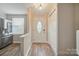 Bright entryway features wood flooring, chandelier, and a decorative front door at 202 Water Oak Dr, Pineville, NC 28134