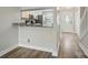 Updated kitchen with granite counters, stainless appliances, and wood flooring at 202 Water Oak Dr, Pineville, NC 28134