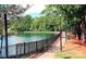 Scenic walking trail along the community lake offering a peaceful outdoor experience at 202 Water Oak Dr, Pineville, NC 28134
