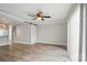 Open floor plan with wood floors, a barn door, and a view into the kitchen at 202 Water Oak Dr, Pineville, NC 28134