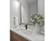 Modern bathroom featuring a sleek white sink, quartz countertops, and a minimalist design at 2108 Lakeview Cir, Matthews, NC 28105