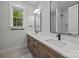 Modern bathroom boasts double sinks, quartz countertops, and sleek fixtures at 2108 Lakeview Cir, Matthews, NC 28105