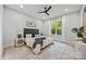 Serene bedroom with a black ceiling fan, natural light, and minimalist decor at 2108 Lakeview Cir, Matthews, NC 28105