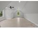 Bright, spacious bonus room with vaulted ceilings, a ceiling fan, and ample natural light at 2108 Lakeview Cir, Matthews, NC 28105