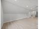 Spacious bonus room with light floors and neutral paint tones; ample room for activities at 2108 Lakeview Cir, Matthews, NC 28105