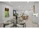 Open floorplan view of dining area leading into the kitchen and living room at 2108 Lakeview Cir, Matthews, NC 28105