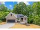 Beautiful home with a two-car garage, landscaped front yard, and a mix of brick and siding at 2108 Lakeview Cir, Matthews, NC 28105