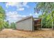 Home exterior featuring siding, a walkout basement, and a back porch at 2108 Lakeview Cir, Matthews, NC 28105