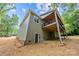 Home exterior featuring siding and a back porch at 2108 Lakeview Cir, Matthews, NC 28105