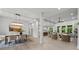 Open-concept living space featuring a dining area, kitchen, and living room with natural light at 2108 Lakeview Cir, Matthews, NC 28105