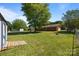 Large backyard with mature trees, shed, and a charming playhouse creates a serene outdoor retreat at 250 Log Barn Rd, Salisbury, NC 28146