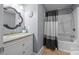 Bathroom featuring an ornate mirror, vanity, and shower-tub combo at 250 Log Barn Rd, Salisbury, NC 28146