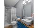 Bathroom with a modern vanity, square sink, and tiled shower with glass door at 250 Log Barn Rd, Salisbury, NC 28146