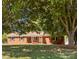 Charming single-story brick home with a well-manicured lawn and mature shade trees at 250 Log Barn Rd, Salisbury, NC 28146