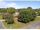 Charming brick home featuring a well-maintained lawn and mature trees on a sunny day at 250 Log Barn Rd, Salisbury, NC 28146