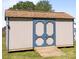 Outdoor storage shed with wooden ramp and blue doors provides ample space for tools and equipment at 250 Log Barn Rd, Salisbury, NC 28146