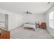 Bright bedroom featuring neutral carpet and ceiling fan at 306 Fesperman Cir, Troutman, NC 28166