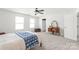 Bedroom with neutral carpet, ceiling fan, and vanity with mirror at 306 Fesperman Cir, Troutman, NC 28166