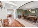 Open-concept dining room featuring hardwood floors, decorative lighting, and stylish decor at 306 Fesperman Cir, Troutman, NC 28166