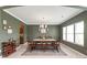 Elegant dining room with hardwood floors, chandelier, and a large dining table at 306 Fesperman Cir, Troutman, NC 28166