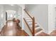 Elegant foyer with hardwood floors, staircase, and a view into the entryway and living area at 306 Fesperman Cir, Troutman, NC 28166