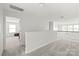 Spacious hallway area with neutral carpeting and access to other rooms at 306 Fesperman Cir, Troutman, NC 28166