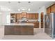 Gourmet kitchen featuring stainless steel appliances, granite countertops, and a large center island at 306 Fesperman Cir, Troutman, NC 28166