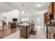 Bright, open kitchen with large island, stainless steel appliances and open concept living space at 306 Fesperman Cir, Troutman, NC 28166