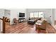 Inviting living room with hardwood floors, lots of natural light, and comfortable seating at 306 Fesperman Cir, Troutman, NC 28166