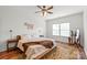 Cozy bedroom with natural light and a ceiling fan, showcasing a relaxed ambiance at 306 Fesperman Cir, Troutman, NC 28166