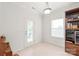Bright room featuring a door to the outside, a window, and a bookcase with a wine cooler at 306 Fesperman Cir, Troutman, NC 28166