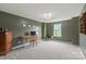 Office room with desk, chair, wood cabinet, and a window with natural light at 306 Fesperman Cir, Troutman, NC 28166
