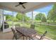 Inviting screened-in patio with outdoor furniture, perfect for enjoying the beautiful backyard views at 306 Fesperman Cir, Troutman, NC 28166
