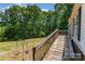 Exterior wooden deck with a view of the backyard and a wooded area at 3442 Cedar Circle Rd, Lancaster, SC 29720