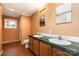 Bathroom featuring dual sinks, twin mirrors, and a vinyl floor at 3442 Cedar Circle Rd, Lancaster, SC 29720