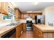 Spacious kitchen featuring wooden cabinets and modern stainless steel appliances at 3442 Cedar Circle Rd, Lancaster, SC 29720