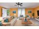 Bright living room with white furniture, wood floors, and natural light at 3442 Cedar Circle Rd, Lancaster, SC 29720