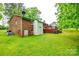 Rear view of the home highlighting the deck and the grassy backyard at 3491 Mcconnells Hwy, Rock Hill, SC 29732
