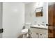 Cozy bathroom with a single sink vanity, toilet, and neutral-toned tile flooring at 3491 Mcconnells Hwy, Rock Hill, SC 29732
