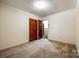 Bedroom with neutral carpet and view into another room at 3491 Mcconnells Hwy, Rock Hill, SC 29732