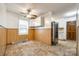 Cozy dining area with retro vinyl floors, wood paneling and ceiling fan at 3491 Mcconnells Hwy, Rock Hill, SC 29732