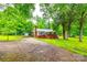 Charming home with a carport and a well-maintained front lawn with mature trees at 3491 Mcconnells Hwy, Rock Hill, SC 29732