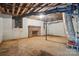Unfinished basement with exposed brick fireplace and utility connections at 410 E 17Th St, Kannapolis, NC 28083