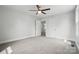 Spacious bedroom with neutral carpet, and access to bathroom at 410 E 17Th St, Kannapolis, NC 28083