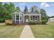 Charming home with navy blue siding, a front porch, and a well-maintained lawn at 410 E 17Th St, Kannapolis, NC 28083