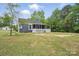 Exterior shot of a home with blue siding and a white picket fence at 410 E 17Th St, Kannapolis, NC 28083